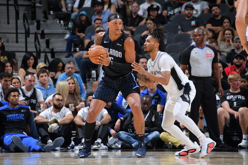 SAN ANTONIO, TX - OCTOBER 9: Paolo Banchero #5 of the Orlando Magic handles the ball during the game against the San Antonio Spurs during a NBA preseason game on October 9, 2024 at the Frost Bank Center in San Antonio, Texas. NOTE TO USER: User expressly acknowledges and agrees that, by downloading and or using this photograph, user is consenting to the terms and conditions of the Getty Images License Agreement. Mandatory Copyright Notice: Copyright 2024 NBAE (Photos by Michael Gonzales/NBAE via Getty Images)