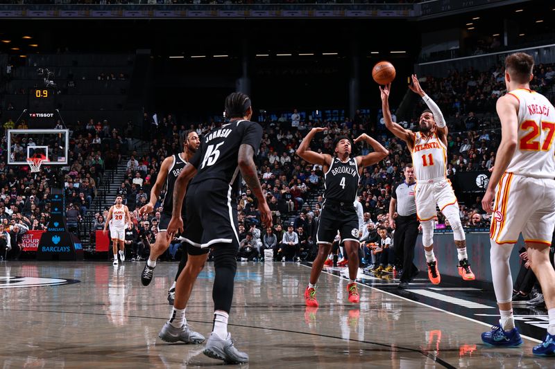 BROOKLYN, NY - MARCH 16: Trae Young #11 of the Atlanta Hawks shoots the ball during the game against the Brooklyn Nets  on March 16, 2025 at Barclays Center in Brooklyn, New York. NOTE TO USER: User expressly acknowledges and agrees that, by downloading and or using this Photograph, user is consenting to the terms and conditions of the Getty Images License Agreement. Mandatory Copyright Notice: Copyright 2025 NBAE (Photo by David L. Nemec/NBAE via Getty Images)