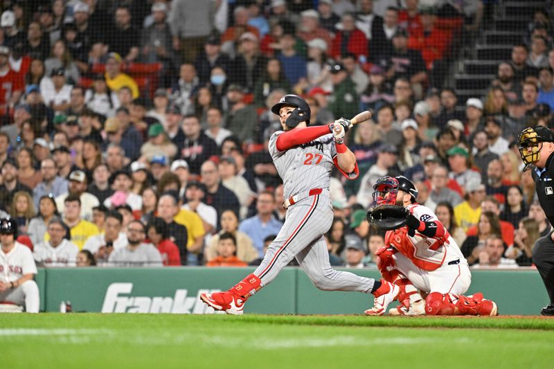 May 2, 2025; Boston, Massachusetts, USA; Minnesota Twins catcher Ryan Jeffers (27) hits a home run against the Boston Red Sox during the third inning at Fenway Park. Mandatory Credit: Eric Canha-Imagn Images