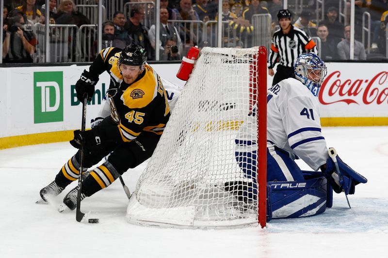 Oct 26, 2024; Boston, Massachusetts, USA; Boston Bruins left wing Cole Koepke (45) cuts around the back of the net as Toronto Maple Leafs goaltender Anthony Stolarz (41) slides over during the first period at TD Garden. Mandatory Credit: Winslow Townson-Imagn Images