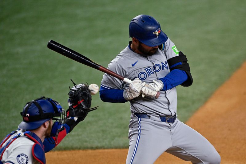 Sep 17, 2024; Arlington, Texas, USA; Toronto Blue Jays left fielder Davis Schneider (36) leans back to avoid getting hit by a pitch from Texas Rangers starting pitcher Nathan Eovaldi (17) during the first inning at Globe Life Field. Mandatory Credit: Jerome Miron-Imagn Images