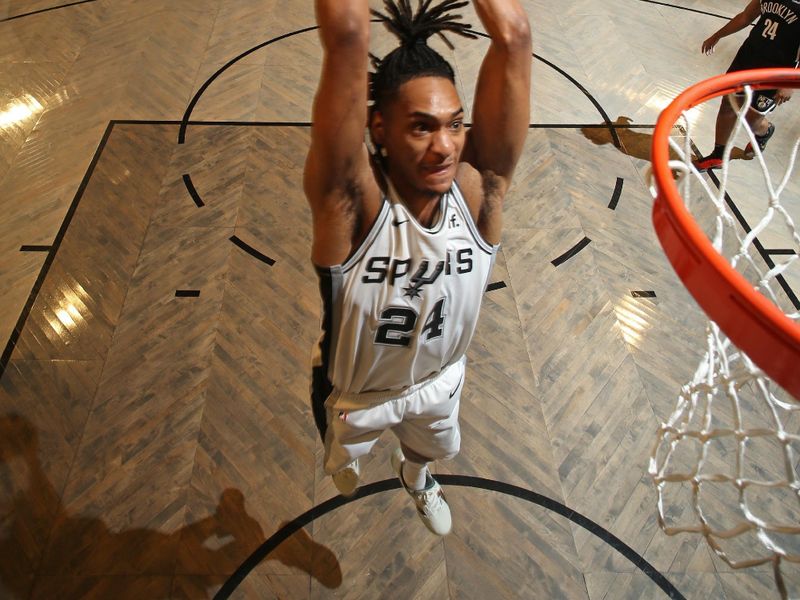 BROOKLYN, NY - FEBRUARY 10: Devin Vassell #24 of the San Antonio Spurs dunks the ball during the game against the Brooklyn Nets on February 10, 2024 at Barclays Center in Brooklyn, New York. NOTE TO USER: User expressly acknowledges and agrees that, by downloading and or using this Photograph, user is consenting to the terms and conditions of the Getty Images License Agreement. Mandatory Copyright Notice: Copyright 2024 NBAE (Photo by Nathaniel S. Butler/NBAE via Getty Images)