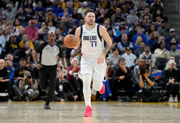 SAN FRANCISCO, CALIFORNIA - DECEMBER 30: Luka Doncic #77 of the Dallas Mavericks dribbles the ball up court against the Golden State Warriors during the third quarter of an NBA basketball game at Chase Center on December 30, 2023 in San Francisco, California. NOTE TO USER: User expressly acknowledges and agrees that, by downloading and or using this photograph, User is consenting to the terms and conditions of the Getty Images License Agreement. (Photo by Thearon W. Henderson/Getty Images)