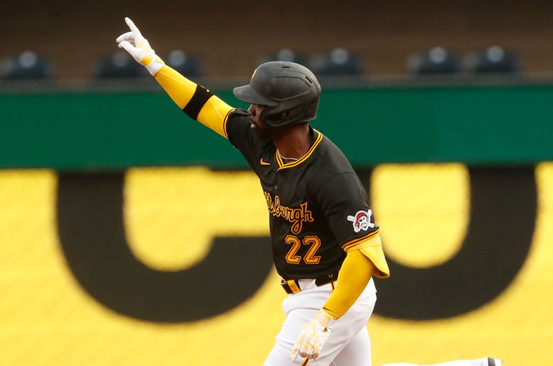 Apr 23, 2024; Pittsburgh, Pennsylvania, USA;  Pittsburgh Pirates designated hitter Andrew McCutchen (22) reacts after a home run against the Milwaukee Brewers during the first inning at PNC Park. Mandatory Credit: Charles LeClaire-USA TODAY Sports