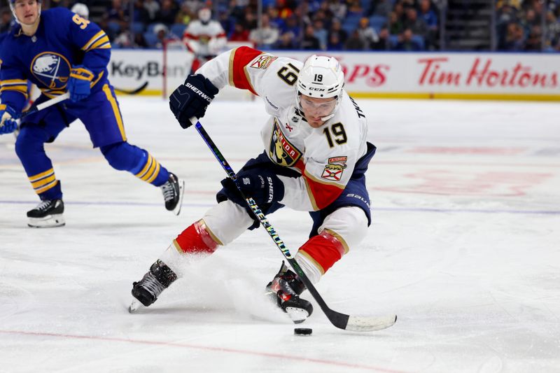 Oct 28, 2024; Buffalo, New York, USA;  Florida Panthers left wing Matthew Tkachuk (19) controls the puck during the third period against the Buffalo Sabres at KeyBank Center. Mandatory Credit: Timothy T. Ludwig-Imagn Images