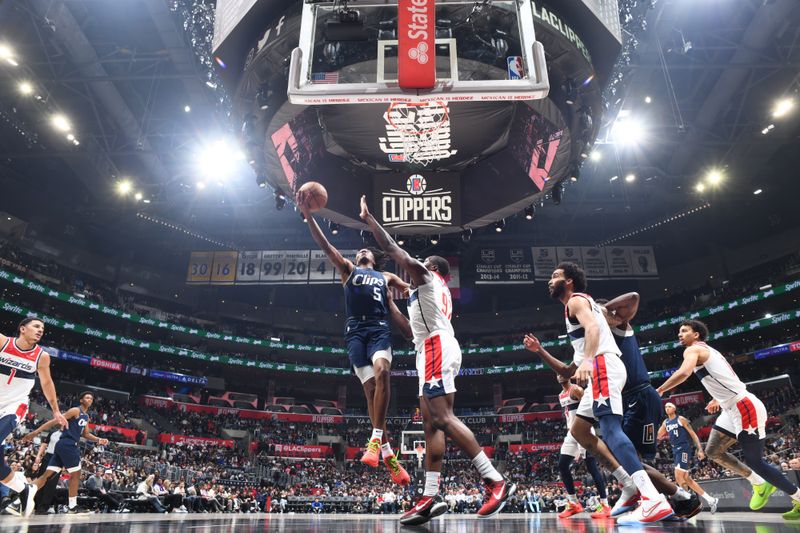 LOS ANGELES, CA - MARCH 1: Bones Hyland #5 of the LA Clippers drives to the basket during the game against the Washington Wizards on March 1, 2024 at Crypto.Com Arena in Los Angeles, California. NOTE TO USER: User expressly acknowledges and agrees that, by downloading and/or using this Photograph, user is consenting to the terms and conditions of the Getty Images License Agreement. Mandatory Copyright Notice: Copyright 2024 NBAE (Photo by Adam Pantozzi/NBAE via Getty Images)