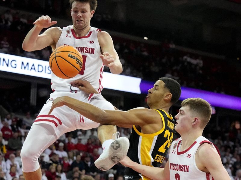 Feb 22, 2023; Madison, Wisconsin, USA; Wisconsin forward Carter Gilmore (14) attempts to grab a rebound during the second half against Iowa at Kohl Center. Mandatory Credit: Mark Hoffman-USA TODAY Sports