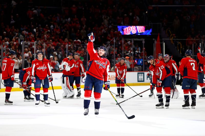 Mar 24, 2024; Washington, District of Columbia, USA; Washington Capitals right wing T.J. Oshie (77) waves to fans in the stands after defeating the Winnipeg Jets at Capital One Arena. Mandatory Credit: Amber Searls-USA TODAY Sports