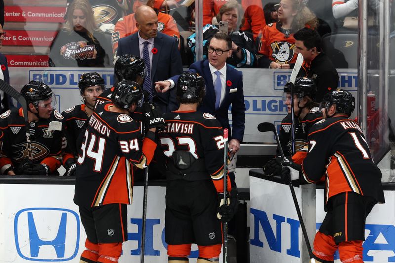 Nov 7, 2023; Anaheim, California, USA; Anaheim Ducks head coach Greg Cronin addresses his team during a time out during the third period against the Pittsburgh Penguins at Honda Center. Mandatory Credit: Kiyoshi Mio-USA TODAY Sports