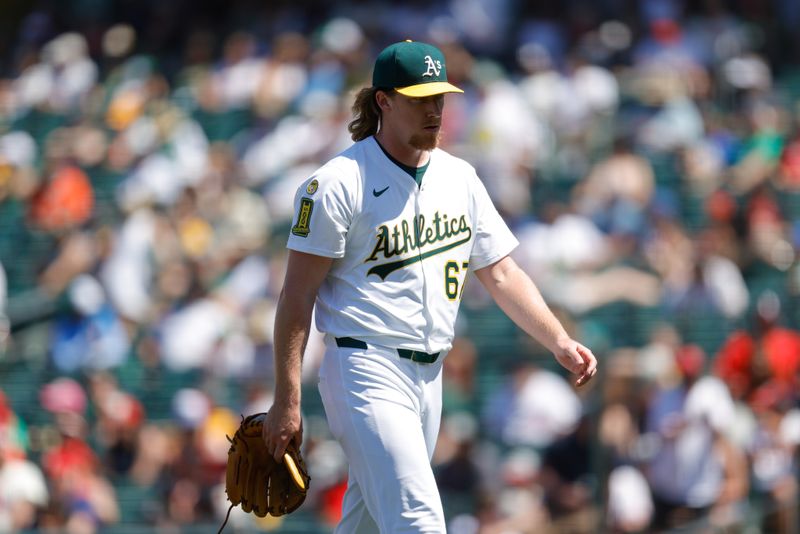 May 22, 2025; West Sacramento, California, USA; Athletics pitcher Grant Holman (67) is removed from the game by manager Mark Kotsay (7) during the seventh inning against the Los Angeles Angels at Sutter Health Park. Mandatory Credit: Sergio Estrada-Imagn Images