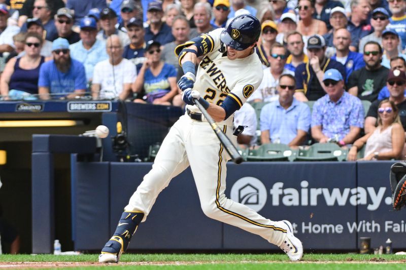 Aug 9, 2023; Milwaukee, Wisconsin, USA; Milwaukee Brewers designated hitter Christian Yelich (22) hits a single in the third inning against the Colorado Rockies at American Family Field. Mandatory Credit: Benny Sieu-USA TODAY Sports