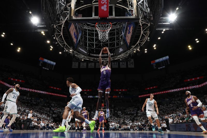 MINNEAPOLIS, MN -  APRIL 20: Bol Bol #11 of the Phoenix Suns handles the ball during Round One Game One of the 2024 NBA Playoffs against the Minnesota Timberwolves on April 20, 2024 at Target Center in Minneapolis, Minnesota. NOTE TO USER: User expressly acknowledges and agrees that, by downloading and or using this Photograph, user is consenting to the terms and conditions of the Getty Images License Agreement. Mandatory Copyright Notice: Copyright 2024 NBAE (Photo by Jordan Johnson/NBAE via Getty Images)