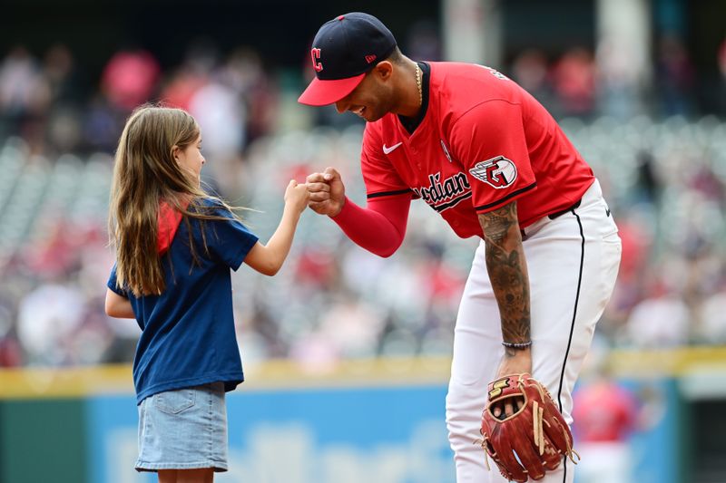 Jun 2, 2024; Cleveland, Ohio, USA; Cleveland Guardians shortstop Brayan Rocchio (4) greets a young fan before the game between the Guardians and the Washington Nationals at Progressive Field. Mandatory Credit: Ken Blaze-USA TODAY Sports