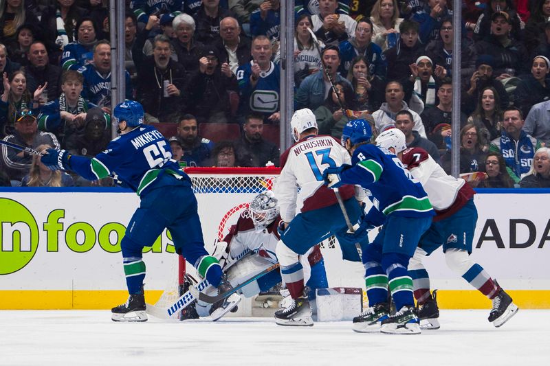 Mar 13, 2024; Vancouver, British Columbia, CAN; Colorado Avalanche forward Valeri Nichushkin (13) watches as Vancouver Canucks forward Ilya Mikheyev (65) scores on goalie Alexandar Georgiev (40) in the first period at Rogers Arena. Mandatory Credit: Bob Frid-USA TODAY Sports
