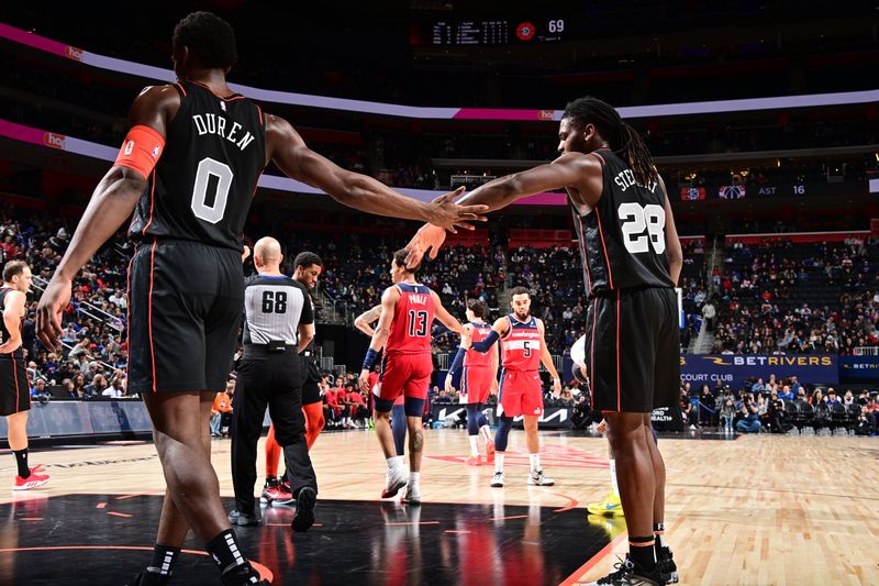 DETROIT, MI - JANUARY 27: Jalen Duren #0 of the Detroit Pistons and Isaiah Stewart #28 of the Detroit Pistons high five during the game against the Washington Wizards on January 27, 2024 at Little Caesars Arena in Detroit, Michigan. NOTE TO USER: User expressly acknowledges and agrees that, by downloading and/or using this photograph, User is consenting to the terms and conditions of the Getty Images License Agreement. Mandatory Copyright Notice: Copyright 2024 NBAE (Photo by Chris Schwegler/NBAE via Getty Images)