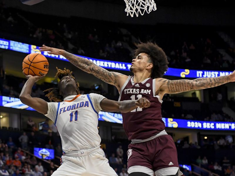 Mar 16, 2024; Nashville, TN, USA;  Texas A&M Aggies forward Andersson Garcia (11) blocks the shot of Florida Gators guard Denzel Aberdeen (11) during the second half at Bridgestone Arena. Mandatory Credit: Steve Roberts-USA TODAY Sports