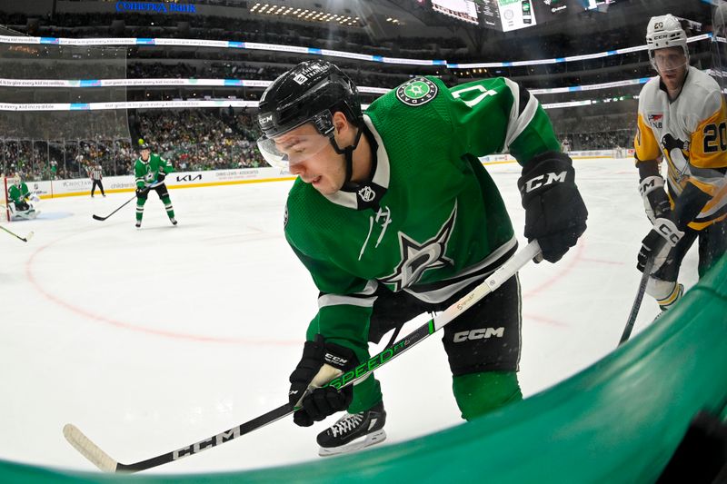 Mar 22, 2024; Dallas, Texas, USA; Dallas Stars center Logan Stankoven (11) looks for the puck during the third period against the Pittsburgh Penguins at the American Airlines Center. Mandatory Credit: Jerome Miron-USA TODAY Sports