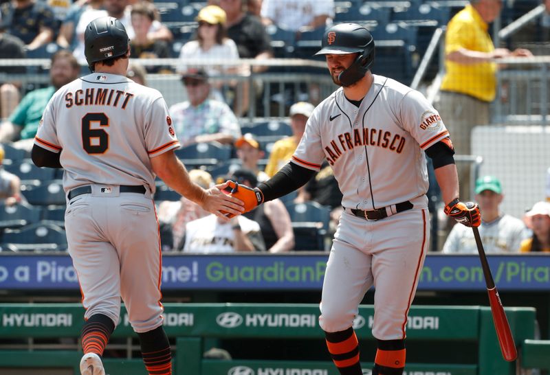 Jul 16, 2023; Pittsburgh, Pennsylvania, USA;  San Francisco Giants right fielder Michael Conforto (8) congratulates shortstop Casey Schmitt (6) on scoring a run against the Pittsburgh Pirates during the tenth inning at PNC Park. Mandatory Credit: Charles LeClaire-USA TODAY Sports