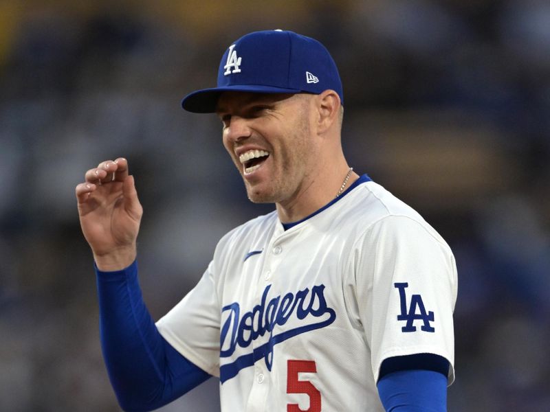 Apr 14, 2024; Los Angeles, California, USA; Los Angeles Dodgers first base Freddie Freeman (5) smiles on the field in the seventh inning against the San Diego Padres at Dodger Stadium. Mandatory Credit: Jayne Kamin-Oncea-USA TODAY Sports