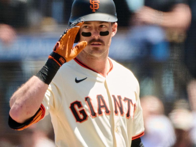 May 19, 2024; San Francisco, California, USA; San Francisco Giants outfielder Mike Yastrzemski (5) gestures toward the Giants dugout after hitting a single against the Colorado Rockies  during the fourth inning at Oracle Park. Mandatory Credit: Robert Edwards-USA TODAY Sports