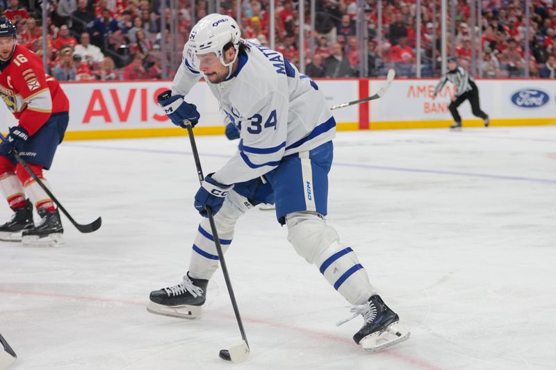 May 16, 2025; Sunrise, Florida, USA; Toronto Maple Leafs center Auston Matthews (34) shoots and scores against the Florida Panthers during the third period in game six of the second round of the 2025 Stanley Cup Playoffs at Amerant Bank Arena. Mandatory Credit: Sam Navarro-Imagn Images