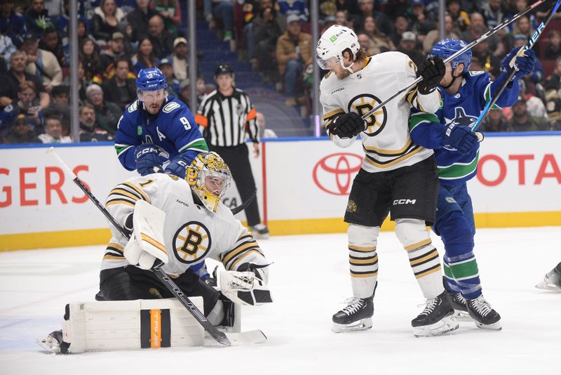 Feb 24, 2024; Vancouver, British Columbia, CAN;  Boston Bruins goaltender Jeremy Swayman (1) and defenseman Parker Wotherspoon (29) defend against Vancouver Canucks forward Pius Suter (24) and forward J.T. Miller (9) during the first period at Rogers Arena. Mandatory Credit: Anne-Marie Sorvin-USA TODAY Sports