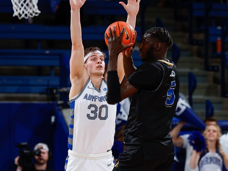 Mar 4, 2023; Colorado Springs, Colorado, USA; San Jose State Spartans center Ibrahima Diallo (5) looks to pass the ball under pressure from Air Force Falcons guard Camden Vander Zwaag (30) in the second half at Clune Arena. Mandatory Credit: Isaiah J. Downing-USA TODAY Sports