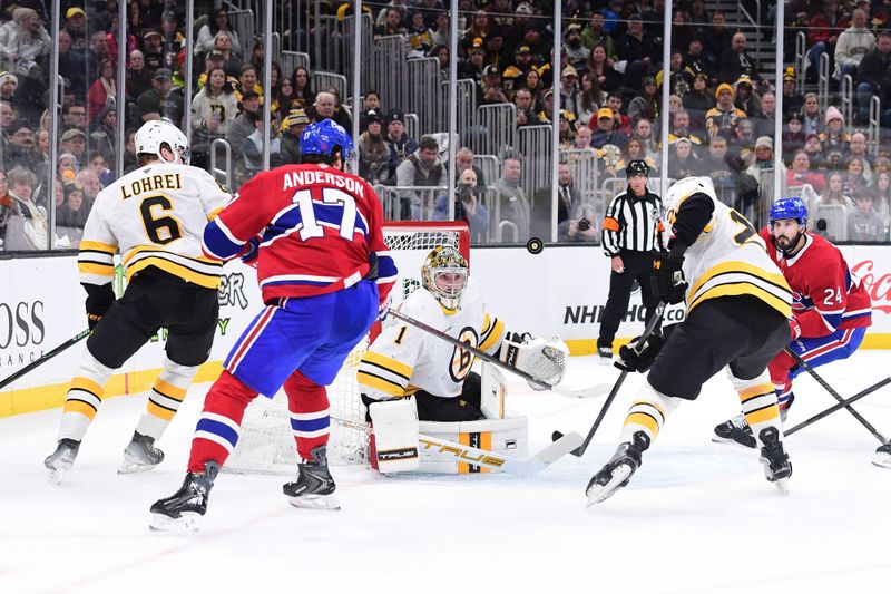 Jan 24, 2026; Boston, Massachusetts, USA; Boston Bruins goaltender Jeremy Swayman (1) eyes the puck in front of Montreal Canadiens right wing Josh Anderson (17) during the second period at TD Garden. Mandatory Credit: Bob DeChiara-Imagn Images