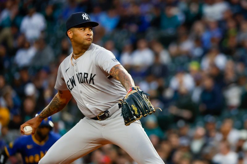 Sep 17, 2024; Seattle, Washington, USA; New York Yankees starting pitcher Luis Gil (81) throws against the Seattle Mariners during the first inning at T-Mobile Park. Mandatory Credit: Joe Nicholson-Imagn Images