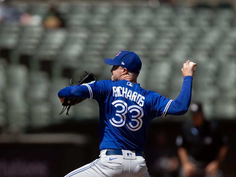 Sep 6, 2023; Oakland, California, USA; Toronto Blue Jays pitcher Trevor Richards (33) delivers a pitch against the Oakland Athletics during the sixth inning at Oakland-Alameda County Coliseum. Mandatory Credit: D. Ross Cameron-USA TODAY Sports