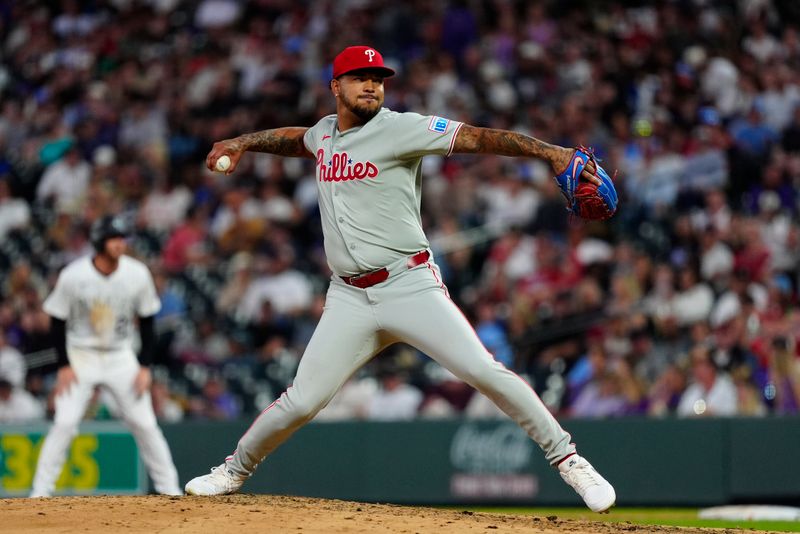 May 21, 2025; Denver, Colorado, USA; Philadelphia Phillies starting pitcher Taijuan Walker (99) delivers a pitch in the fifth inning against the Colorado Rockies at Coors Field. Mandatory Credit: Ron Chenoy-Imagn Images