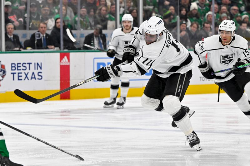 Jan 16, 2024; Dallas, Texas, USA; Los Angeles Kings center Anze Kopitar (11) shoots the puck in the Dallas Stars zone during the first period at the American Airlines Center. Mandatory Credit: Jerome Miron-USA TODAY Sports