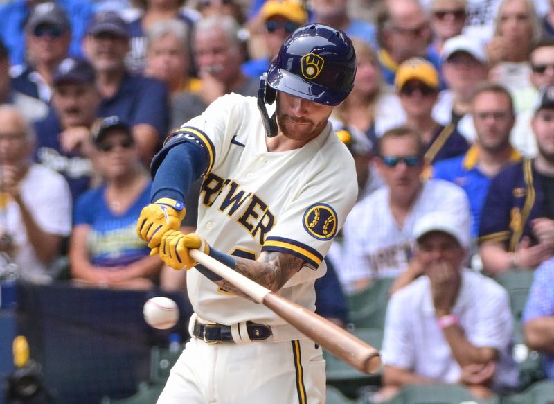 Aug 9, 2023; Milwaukee, Wisconsin, USA; Milwaukee Brewers second baseman Brice Turang (2) hits a single in the second inning against the Colorado Rockies at American Family Field. Mandatory Credit: Benny Sieu-USA TODAY Sports