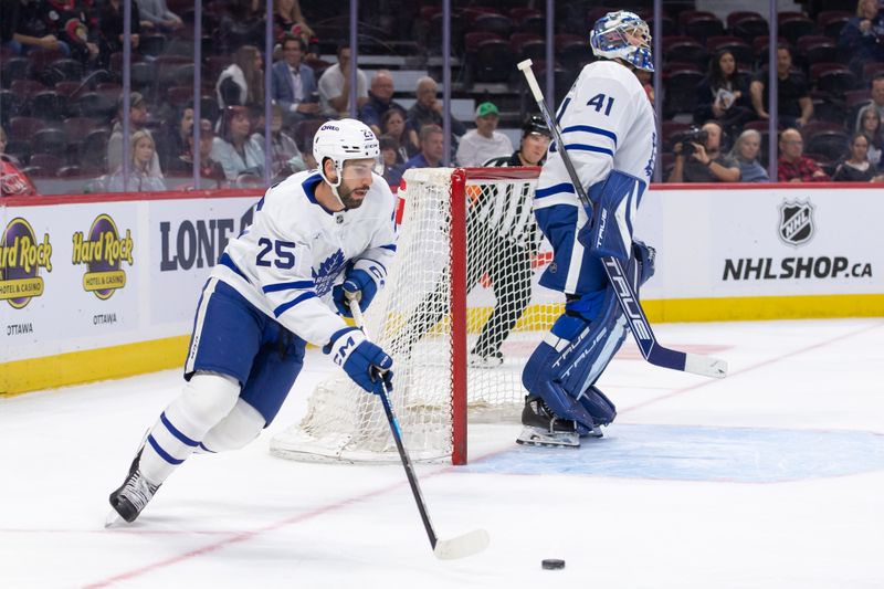 Sep 24, 2024; Ottawa, Ontario, CAN; Toronto Maple Leafs defenseman Conor Timmins (25) skates with the puck in the first period against the Ottawa Senators at the Canadian Tire Centre. Mandatory Credit: Marc DesRosiers-Imagn Images