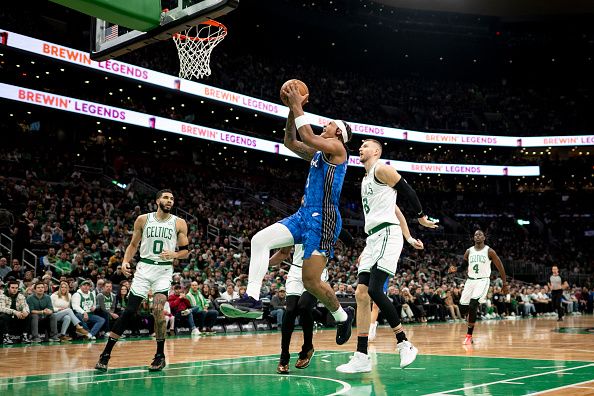 BOSTON, MASSACHUSETTS - DECEMBER 17: Paolo Banchero #5 of the Orlando Magic drives to the basket during the first half against the Boston Celtics at TD Garden on December 17, 2023 in Boston, Massachusetts. NOTE TO USER: User expressly acknowledges and agrees that, by downloading and or using this photograph, user is consenting to the terms and conditions of the Getty Images License Agreement. (Photo by Maddie Malhotra/Getty Images)