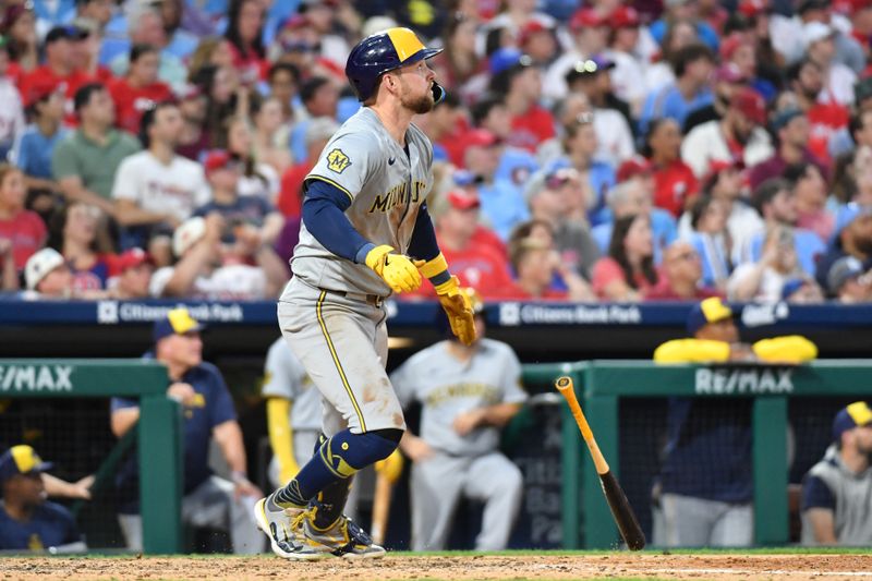 Jun 3, 2024; Philadelphia, Pennsylvania, USA; Milwaukee Brewers first base Rhys Hoskins (12) watches his home run against the Philadelphia Phillies during the seventh inning at Citizens Bank Park. Mandatory Credit: Eric Hartline-USA TODAY Sports