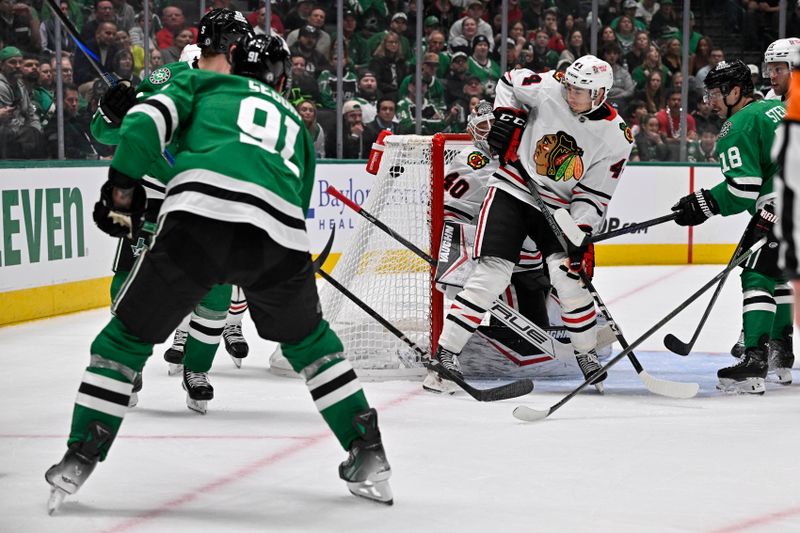 Nov 7, 2024; Dallas, Texas, USA; Dallas Stars center Tyler Seguin (91) scores a goal against Chicago Blackhawks goaltender Arvid Soderblom (40) during the second period at the American Airlines Center. Mandatory Credit: Jerome Miron-Imagn Images