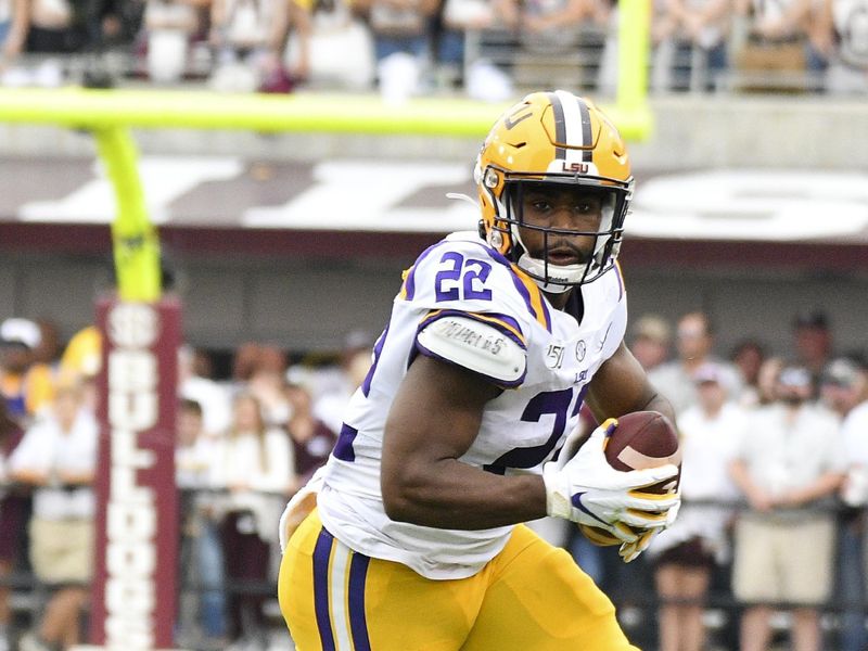 Oct 19, 2019; Starkville, MS, USA; Louisiana State Tigers  running back Clyde Edwards Helaire (22) runs the ball against the Mississippi State Bulldogs during the second quarter at Davis Wade Stadium. Mandatory Credit: Matt Bush-USA TODAY Sports