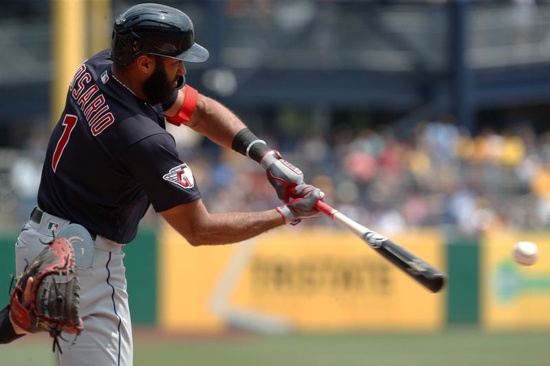 Jul 19, 2023; Pittsburgh, Pennsylvania, USA;  Cleveland Guardians shortstop Amed Rosario (1) at bat against the Pittsburgh Pirates during the fourth inning at PNC Park. Mandatory Credit: Charles LeClaire-USA TODAY Sports