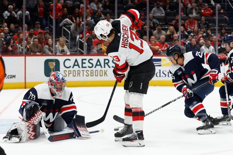 Feb 20, 2024; Washington, District of Columbia, USA; Washington Capitals goaltender Charlie Lindgren (79) makes a save on New Jersey Devils center Nico Hischier (13) in the first period at Capital One Arena. Mandatory Credit: Geoff Burke-USA TODAY Sports