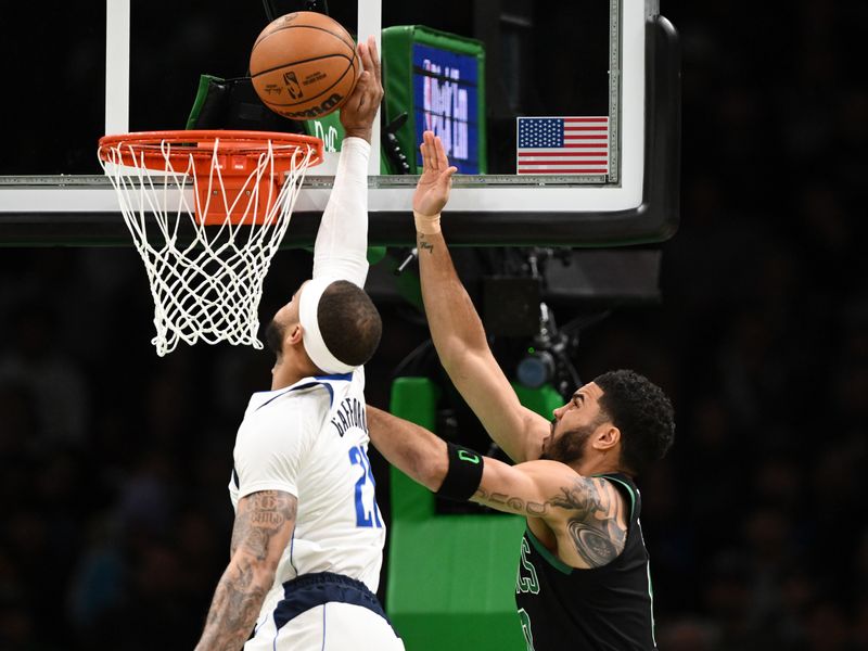 BOSTON, MASSACHUSETTS - MARCH 01: Daniel Gafford #21 of the Dallas Mavericks defends Jayson Tatum #0 of the Boston Celtics during the first quarter at the TD Garden on March 01, 2024 in Boston, Massachusetts. NOTE TO USER: User expressly acknowledges and agrees that, by downloading and or using this photograph, User is consenting to the terms and conditions of the Getty Images License Agreement. (Photo by Brian Fluharty/Getty Images)