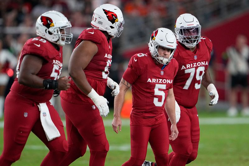 Arizona Cardinals place kicker Matt Prater (5) reacts with teammates after missing a field goal attempt against the Denver Broncos during the first half of an NFL preseason football game in Glendale, Ariz., Friday, Aug. 11, 2023. (AP Photo/Matt York)