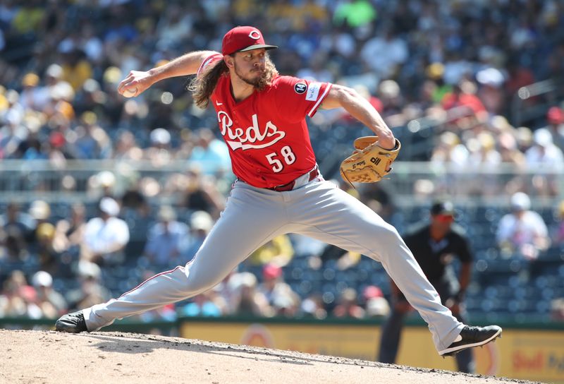 Aug 10, 2025; Pittsburgh, Pennsylvania, USA;  Cincinnati Reds relief pitcher Scott Barlow (58) pitches against the Pittsburgh Pirates during the fifth inning at PNC Park. Mandatory Credit: Charles LeClaire-Imagn Images