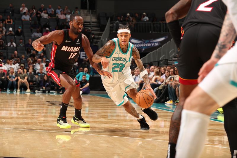 CHARLOTTE, NC - OCTOBER 8: Tre Mann #23 of the Charlotte Hornets drives to the basket during the game against the Miami Heat during a preseason game on October 8, 2024 at Spectrum Center in Charlotte, North Carolina. NOTE TO USER: User expressly acknowledges and agrees that, by downloading and or using this photograph, User is consenting to the terms and conditions of the Getty Images License Agreement. Mandatory Copyright Notice: Copyright 2024 NBAE (Photo by Kent Smith/NBAE via Getty Images)