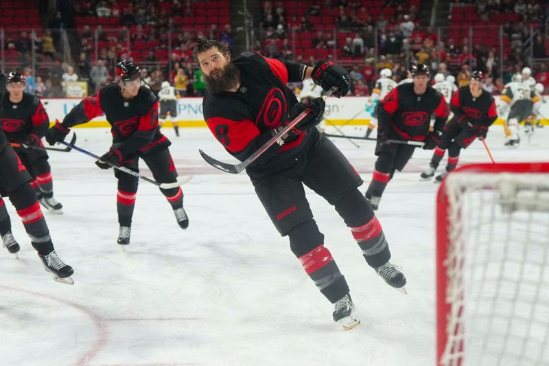 Mar 11, 2023; Raleigh, North Carolina, USA; Carolina Hurricanes defenseman Brent Burns (8) takes a shot before the game against the Vegas Golden Knights at PNC Arena. Mandatory Credit: James Guillory-USA TODAY Sports