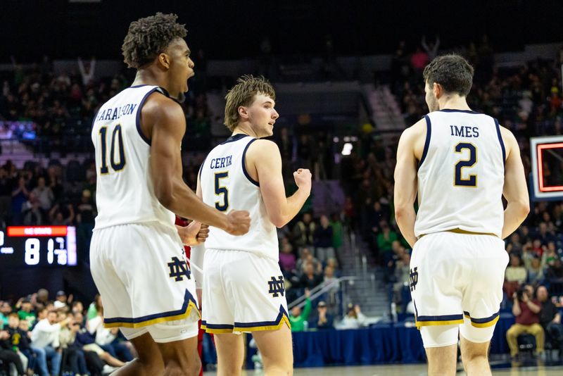 Feb 28, 2026; South Bend, Indiana, USA; Notre Dame Fighting Irish forward Jalen Haralson (10), guard Cole Certa (5) and guard Logan Imes (2) celebrate at the second half at Purcell Pavilion at the Joyce Center. Mandatory Credit: Michael Caterina-Imagn Images