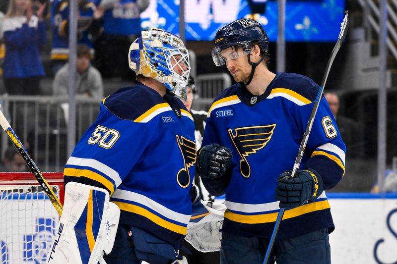 Mar 23, 2025; St. Louis, Missouri, USA;  St. Louis Blues goaltender Jordan Binnington (50) and defenseman Philip Broberg (6) celebrate after the Blues defeated the Nashville Predators at Enterprise Center. Mandatory Credit: Jeff Curry-Imagn Images