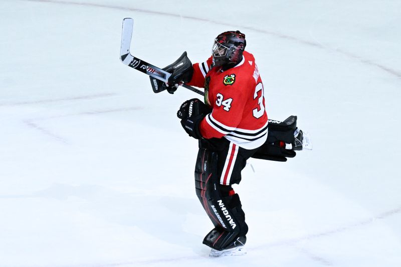 Jan 16, 2024; Chicago, Illinois, USA; Chicago Blackhawks goaltender Petr Mrazek (34) celebrates after beating the San Jose Sharks in overtime at United Center. Mandatory Credit: Matt Marton-USA TODAY Sports