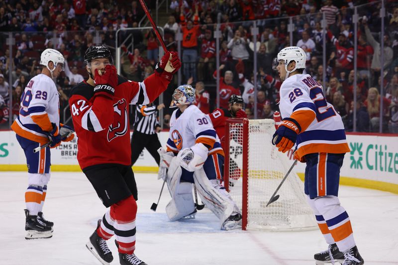 Oct 25, 2024; Newark, New Jersey, USA; New Jersey Devils center Curtis Lazar (42) celebrates his goal against the New York Islanders during the second period at Prudential Center. Mandatory Credit: Ed Mulholland-Imagn Images