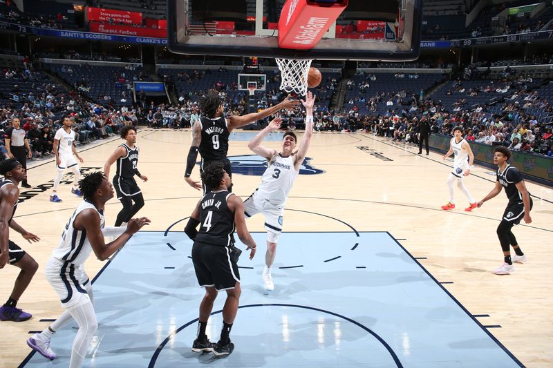 MEMPHIS, TN - February 26:  Jake LaRavia #3 of the Memphis Grizzlies drives to the basket during the game against the Brooklyn Nets on February 26, 2024 at FedExForum in Memphis, Tennessee. NOTE TO USER: User expressly acknowledges and agrees that, by downloading and or using this photograph, User is consenting to the terms and conditions of the Getty Images License Agreement. Mandatory Copyright Notice: Copyright 2024 NBAE (Photo by Joe Murphy/NBAE via Getty Images)